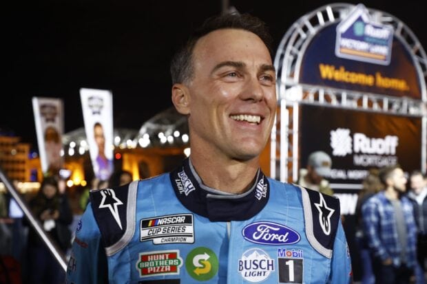 Kevin Harvick is smiling wearing a racing suit with sponsors and logos, HD Desktop Wallpaper