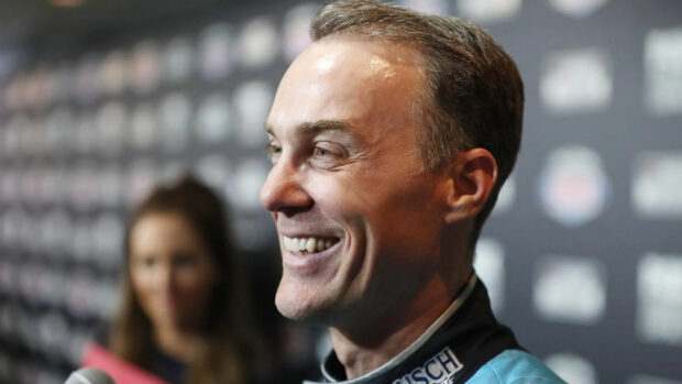 Kevin Harvick is smiling during a media interview at a racing event, HD Desktop Wallpaper