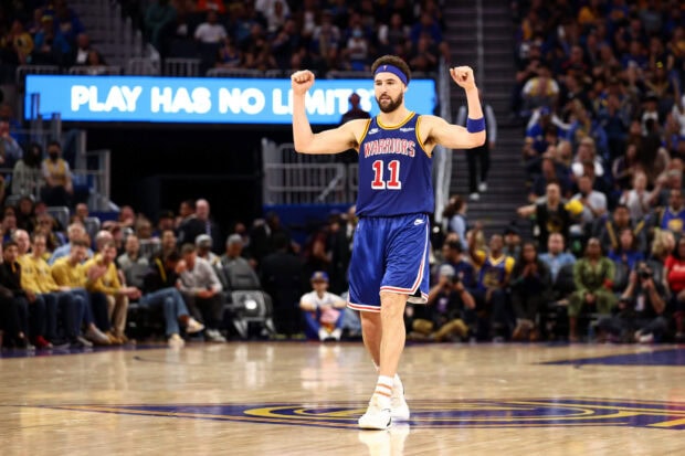 Klay Thompson is celebrating during a basketball game in a Warriors uniform, 2K Desktop Wallpaper