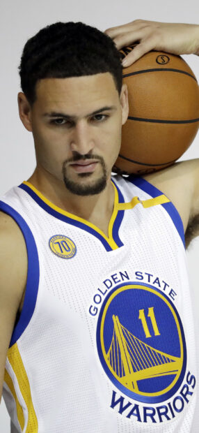 Klay Thompson poses with a basketball wearing Golden State Warriors jersey, HD Phone Wallpaper