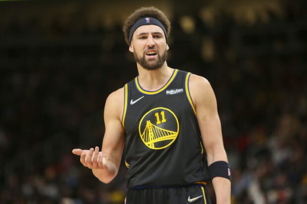 Klay Thompson focused on the court wearing a Golden State Warriors jersey, 2K Desktop Wallpaper
