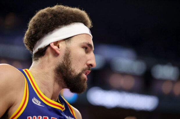 Klay Thompson focuses intensely while playing basketball at the arena, HD Desktop Wallpaper