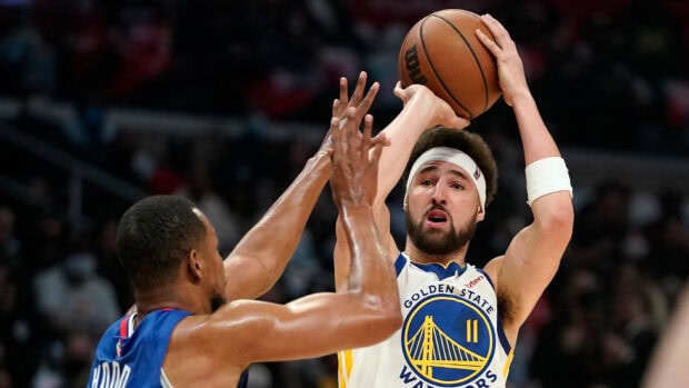 Klay Thompson is taking a jump shot during a basketball game, HD Desktop Wallpaper
