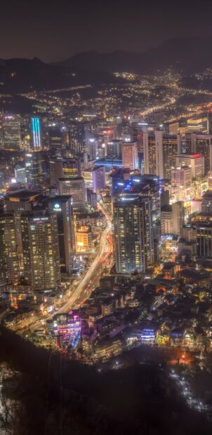 Night view of a Korea cityscape with bright lights and tall buildings at night