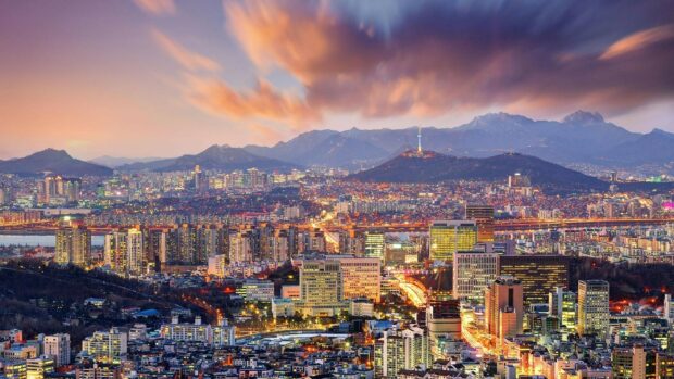 Seoul cityscape with Korea evening lights and mountains in the background