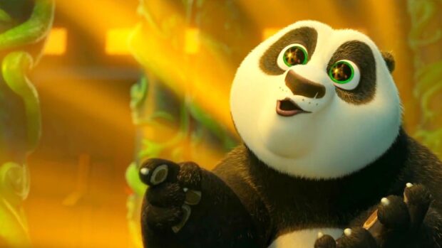 A panda character with bright green eyes is shown in a vibrant scene from Kung Fu Panda 3, HD Desktop Wallpaper