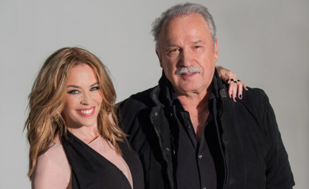 Kylie Minogue appears with a man wearing a black jacket in a studio, 2K Desktop Wallpaper