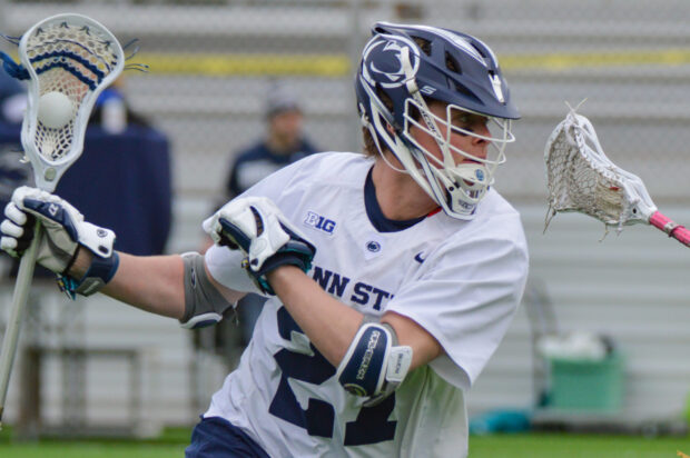 A lacrosse player is preparing to pass the ball during a game, 2K Desktop Wallpaper
