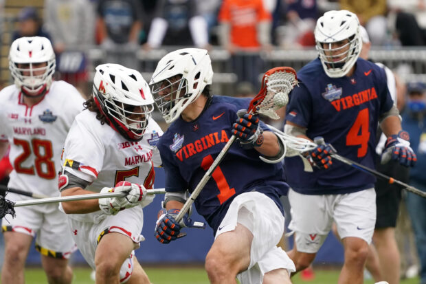 Lacrosse players competing intensely in a dynamic game on the field, 2K Desktop Wallpaper