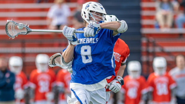 A lacrosse player in a blue jersey is preparing to throw the ball during a match, HD Desktop Wallpaper