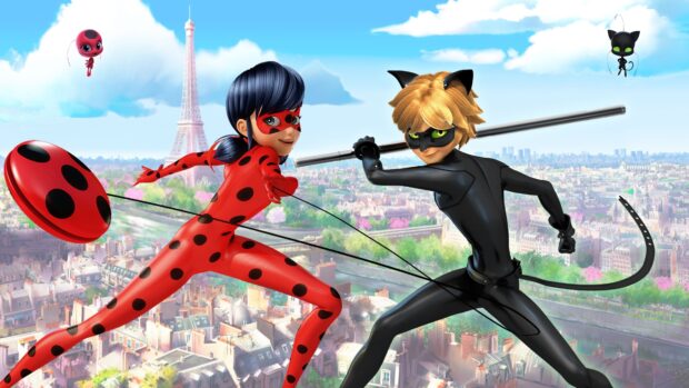 Ladybug and Cat Noir characters posing heroically above Paris cityscape