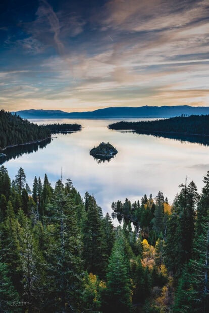 A tranquil view of Lake Tahoe Emerald Bay surrounded by forested mountains, HD Mobile Wallpaper