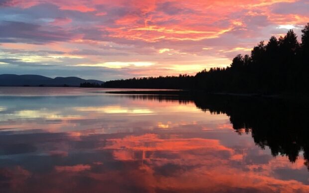 Lake Tahoe Emerald Bay reflects vibrant colors during sunset over the calm water, HD Desktop Wallpaper
