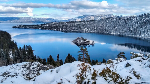 Lake Tahoe Emerald Bay showcases a snowy landscape and clear blue water in this serene scene, HD Desktop Wallpaper
