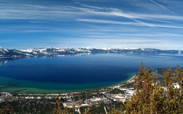 A panoramic view of Lake Tahoe Emerald Bay with clear skies and surrounding mountains, HD Desktop Wallpaper