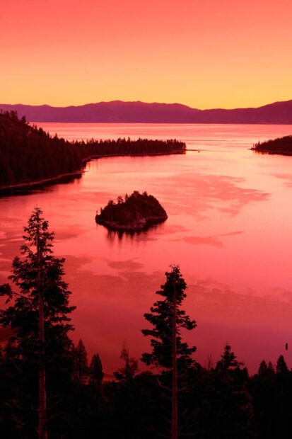 The peaceful Lake Tahoe Emerald Bay glows under a vibrant sunset sky, HD Phone Wallpaper