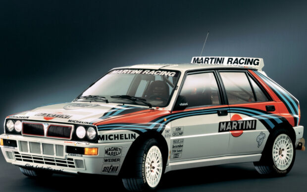 A white Lancia rally car with Martini Racing livery is shown in a studio, HD Desktop Wallpaper