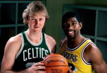 Larry Bird and Magic Johnson stand holding a basketball in a locker room, HD Desktop Wallpaper