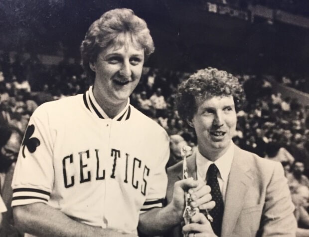 Larry Bird and a man holding a trophy and smiling in a vintage photo, HD Desktop Wallpaper