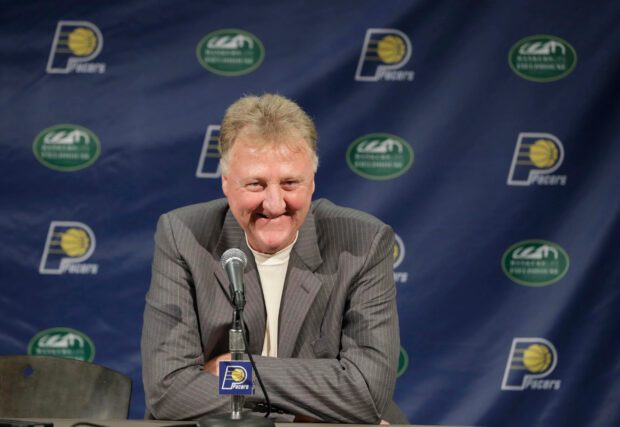 Larry Bird is smiling during a press conference with Pacers logos behind him, 2K Desktop Wallpaper