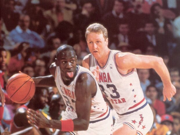 Larry Bird is guarding an opponent during an intense NBA All Star game, HD Desktop Wallpaper