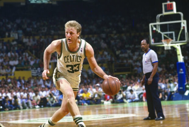 Larry Bird dribbling the basketball during a game in Celtics uniform, 2K Desktop Wallpaper