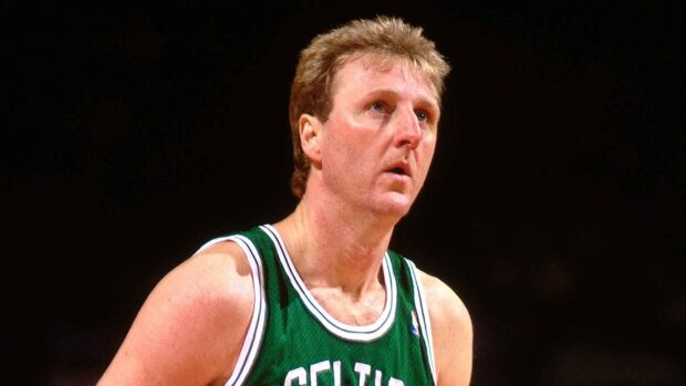 Larry Bird is focused during a basketball game wearing a Celtics jersey, HD Desktop Wallpaper