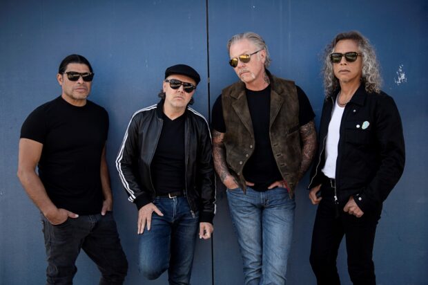 Lars Ulrich wallpapers show the band members standing against a blue wall, HD Desktop Wallpaper