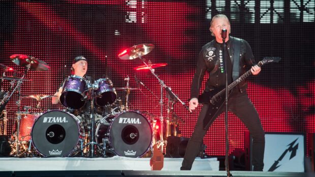 Lars Ulrich Wallpapers show the dynamic concert setting with drummer and guitarist, HD Desktop Wallpaper