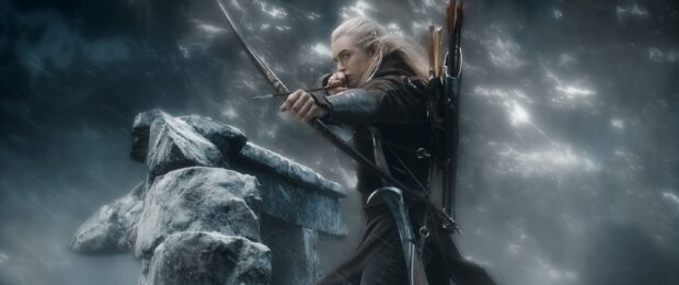 Legolas aiming his bow with focused eyes near ancient stone ruins in a stormy environment