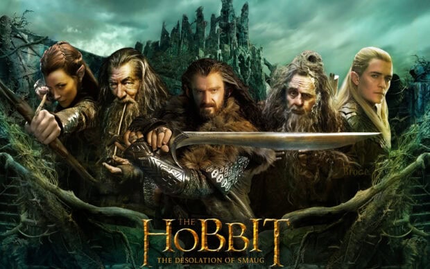 Legolas with his bow and other characters from The Hobbit in a fantasy forest scene