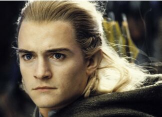Close up of Legolas with focused eyes and blonde hair in an intense moment
