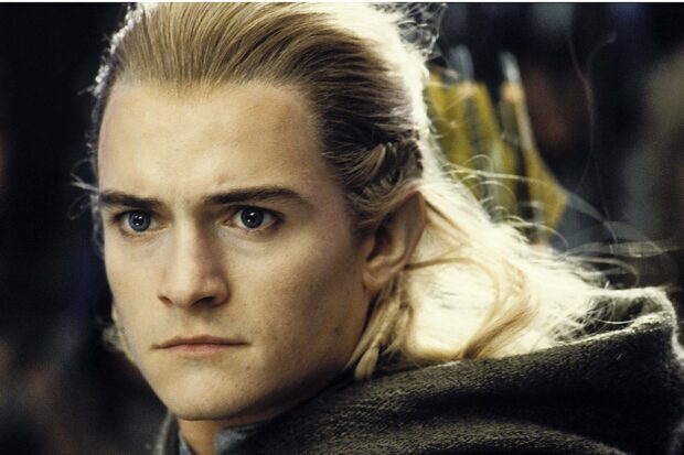 Close up of Legolas with focused eyes and blonde hair in an intense moment