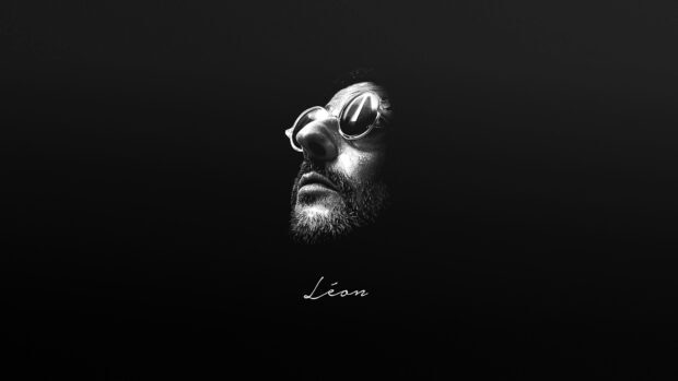 A detailed Leon portrait with reflective glasses on a dark background, 4K Desktop Wallpaper