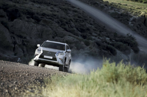 A Lexus GX drives on a rough mountain trail kicking up dust behind, HD Desktop Wallpaper
