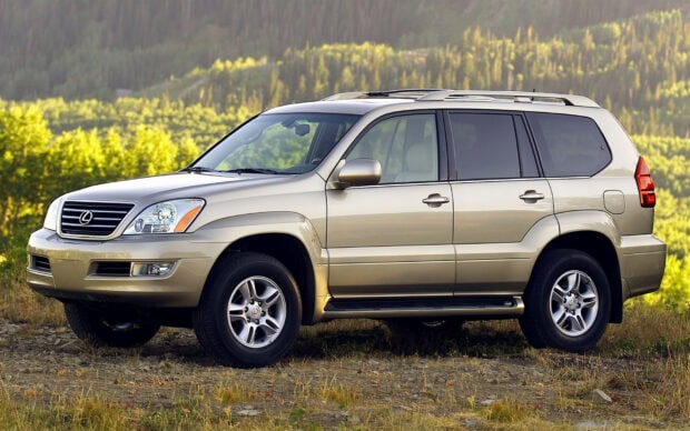 A Lexus GX SUV parked in a forest area with green trees in the background, HD Desktop Wallpaper