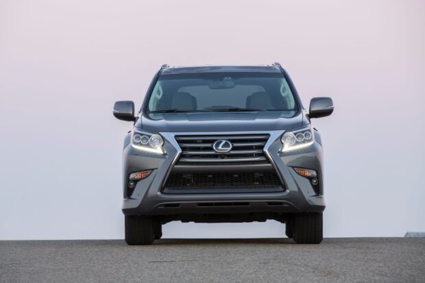 A Lexus GX facing forward with headlights on during the day, 2K Desktop Wallpaper
