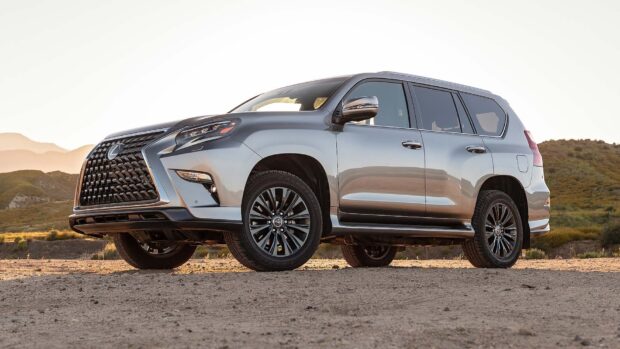 A silver Lexus GX is parked on a dirt road with mountains in the background, HD Desktop Wallpaper
