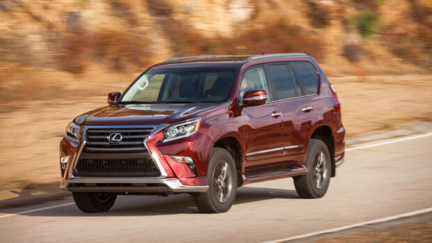 A red Lexus Gx is driving on a winding road with blurred background, 4K Desktop Wallpaper