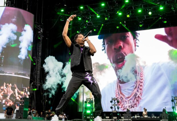 Lil Baby is rapping during a concert with a large screen behind him, HD Desktop Wallpaper