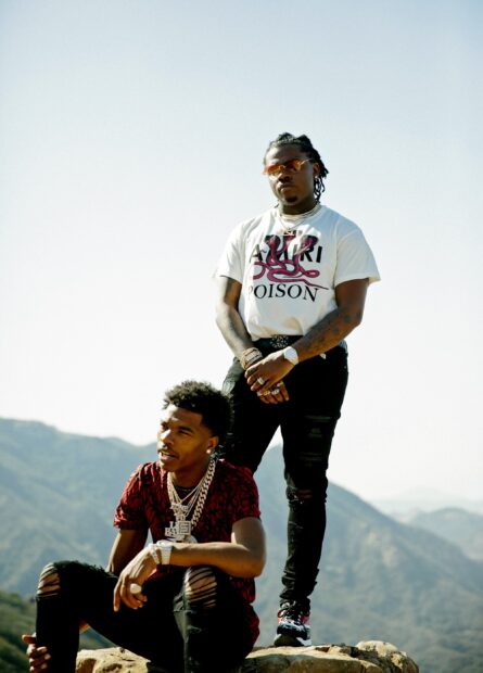 Lil Baby Wallpapers shows two men posing with scenic mountain views behind them, 2K Mobile Wallpaper