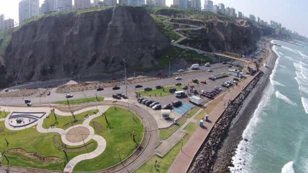 Aerial view of Lima Peru showing cliffs, roads, and buildings near the coast, 2K Desktop Wallpaper