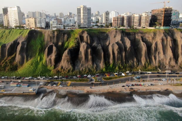 The Lima Peru Wallpapers view shows cliffs and ocean waves against the city, HD Desktop Wallpaper