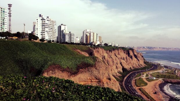 A coastal view shows Lima Peru with cliffs and buildings by the ocean, HD Desktop Wallpaper