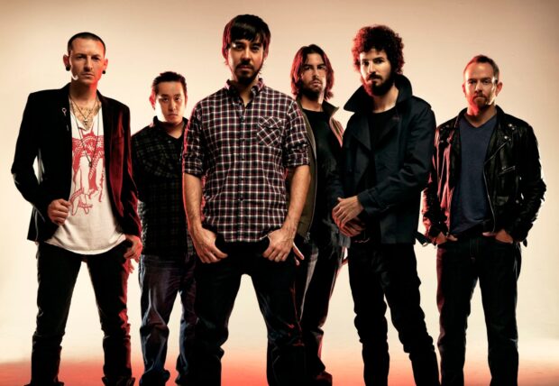 Linkin Park band members standing together in a studio setting