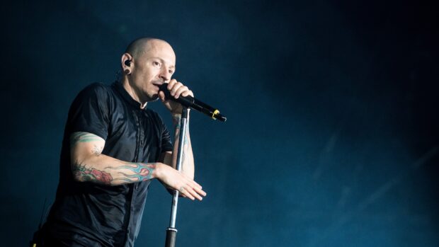 Chester Bennington from Linkin Park singing passionately during a live concert