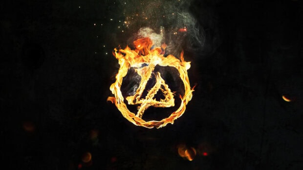 Linkin Park logo made of fire flames on a dark background with smoky effects