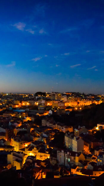 The Lisbon Portugal captures the glowing city lights under a clear evening sky, HD Phone Wallpaper