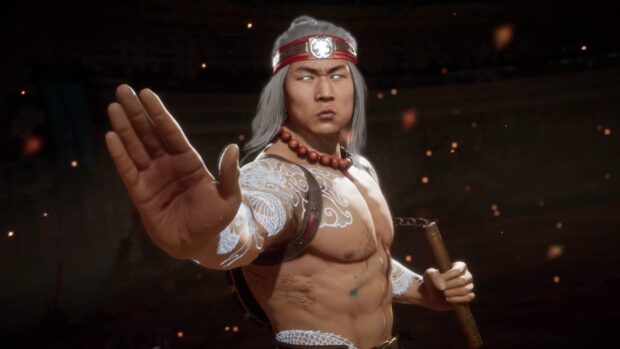 Liu Kang showing his martial arts pose with glowing eyes and detailed tattoos