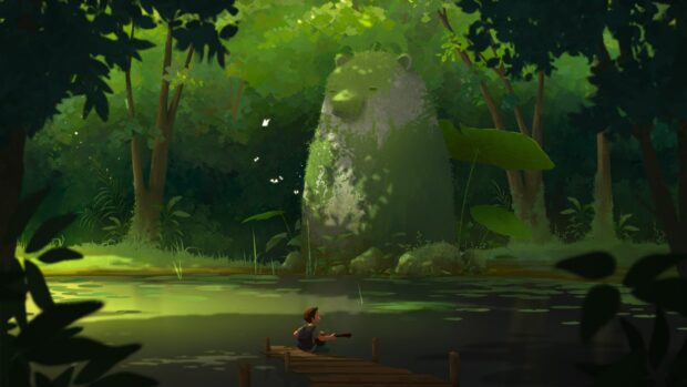 A boy playing guitar on a dock near a moss covered bear statue in the forest